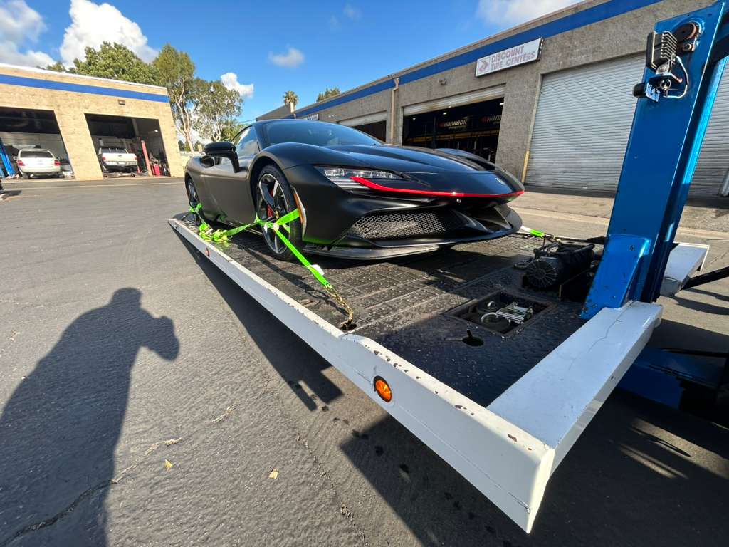 Ferrari SF90 front three-quarter on tilted zero-degree bed